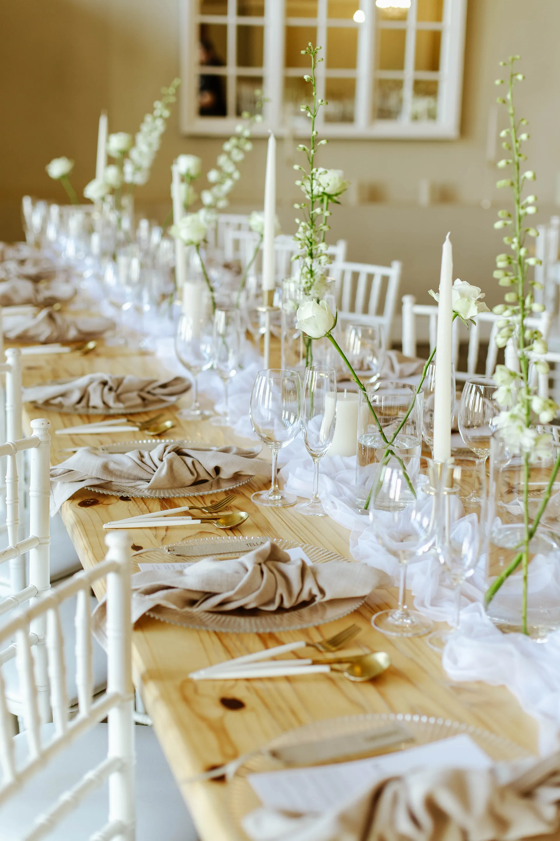 A warmly lit wedding reception space styled by A&I Fynbos.